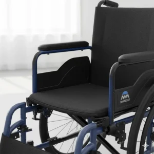 Close-up of padded seating and breathable upholstery on a lightweight transit wheelchair.