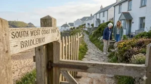 Close-up of deep-tread pneumatic tyres designed for grip on wet grass and loose gravel.