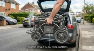 An individual lifting a lightweight electric wheelchair frame to demonstrate how easy it is to load into a car boot without a hoist.