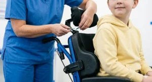 Close-up of technical postural support adjustments on an NHS powerchair for children with complex needs.