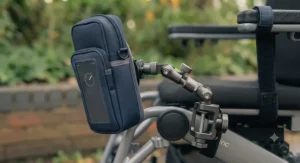 A versatile phone holder with an adjustable mount for various wheelchair models.
