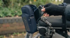 Demonstration of quick-access design on a wheelchair phone pouch for daily use.