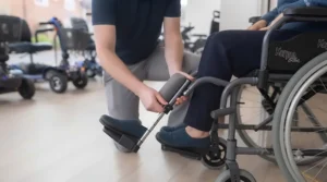 Wheelchair fitted with elevating leg rests raised at an angle to support circulation and oedema management.