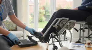 Step-by-step guide showing how to attach compatible elevating footrests to a standard mobility wheelchair.
