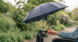 A robust clip-on umbrella standing firm against strong gusts of wind on a British street.