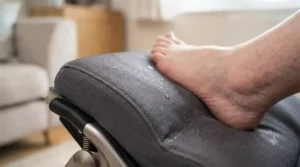 Durable, wipe-clean antimicrobial fabric covering a supportive wheelchair footrest for daily care.